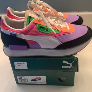 Woman’s Puma rider play on shoes